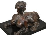 bronze sculpture of a woman and a dog on a black marble base