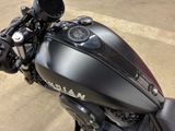 a close up of a motorcycle parked in a parking lot