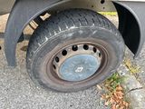 a flat tire on the back of a truck
