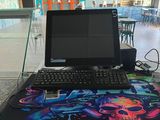 a desk with a laptop and a keyboard on it