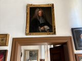 a painting on the wall above a doorway in a room