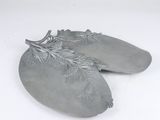 a pair of silver shoes that are on a white surface