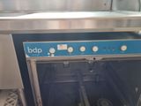 a blue and silver oven that is open and has a metal door