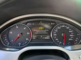 a close up of a car dashboard with various gauges