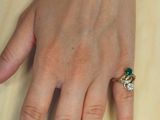 a woman ' s hand that is holding a cell phone