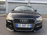the front of a black audi car parked in a parking lot