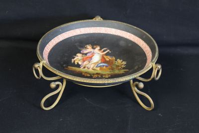an image of a plate with a painting on it on a stand