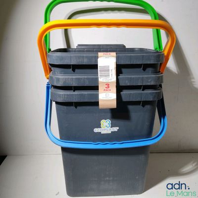 a stack of plastic containers sitting on top of a table