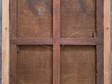a window with a wooden frame on the side of a building