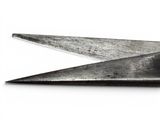 a pair of scissors that are on a white surface