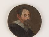 portrait of a man with a beard in a black coat and a white collar
