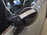 a sticker on the side mirror of a car