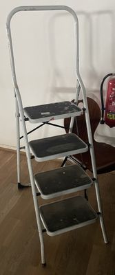 three step stools next to each other on a wooden floor