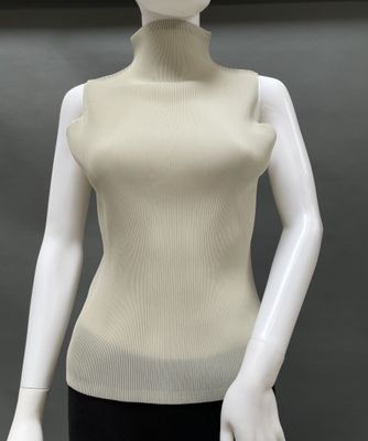 an image of a mannequin wearing a white top and black pants