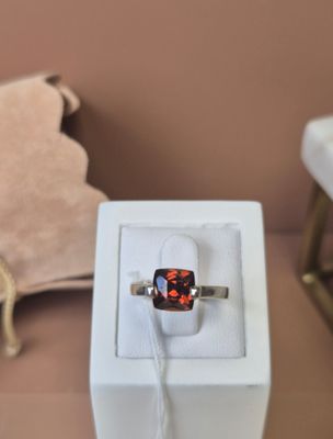 a ring that is sitting in a box on a table
