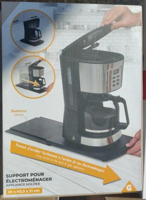 packaging of a coffee maker on display in a store
