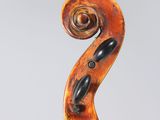 an old violin with a long neck and a long bow
