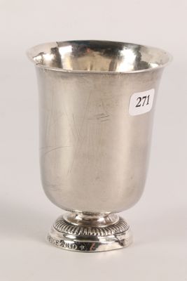 a silver cup on a pedestal with a price tag on it