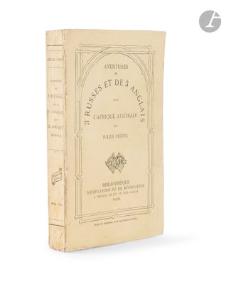 an old book sitting on top of a table next to a white background
