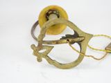 a pair of scissors and a spool on a white surface