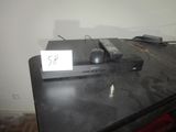 a remote control sitting on top of a black table