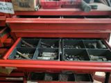 a red workbench with a lot of tools in it
