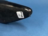 a close up of a bike seat on a blue surface