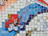 a picture of a mosaic with a bird on it