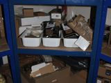 many boxes and containers on the shelves in the room