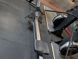 a row of stationary exercise bikes in a gym