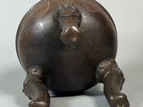 a bronze statue of an elephant on a white background