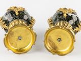 pair of gold and black marble candlesticks on stands