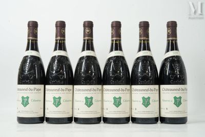 six bottles of wine are lined up in a row on a table