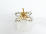 an image of a gold and silver ring with diamonds on it