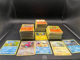 a lot of pokemon cards sitting on a table