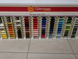 a display of different colored threads in a store