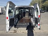 a white van with its doors open in a parking lot