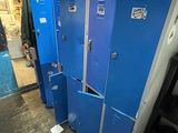 several blue lockers are lined up in a row in a room
