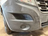 the front bumper of a car with a denting dent on it