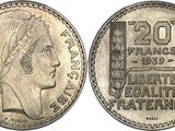 a close up of a coin with a woman ' s face on it