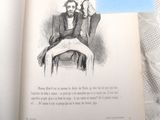 un livre sur lequel figure le dessin d'un homme assis sur une chaise