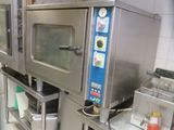 a picture of a commercial kitchen with stainless steel appliances