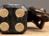 a close up of a dice with four dots on it