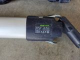 a black and white corded blower on the ground