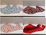 several different types of scarves are displayed on a shelf