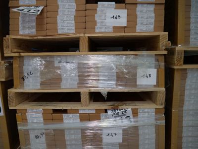 many stacks of boxes on the shelves in the warehouse