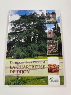 a book with a picture of a large tree in the middle of it