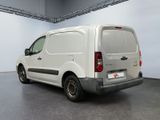 a white van that is parked inside of a building