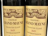 three bottles of wine sitting on top of a table next to each other