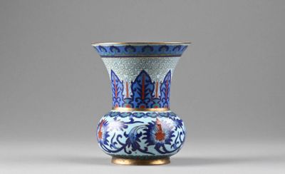 a blue and white vase sitting on a table